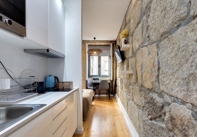 Equipped kitchen in a studio with a terrace in Porto